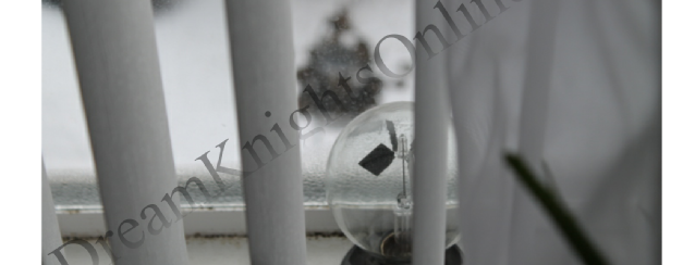 Glass solar globe on cold window ledge